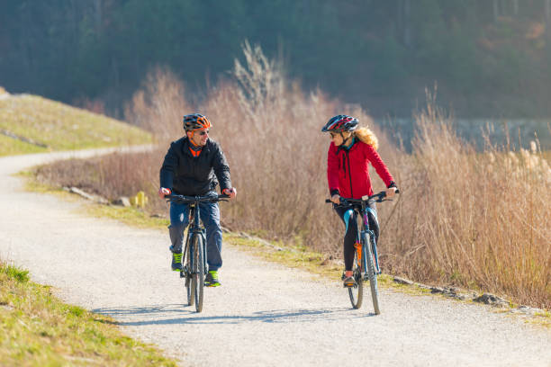 istock Couple Cycling Through Countryside Together 654061054