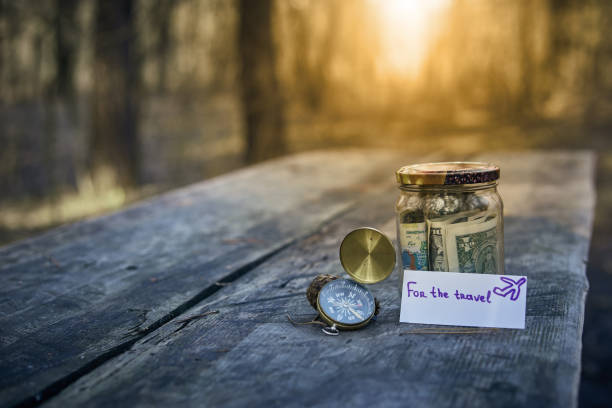istock Piggy bank with money to make a dream come true. 654061216