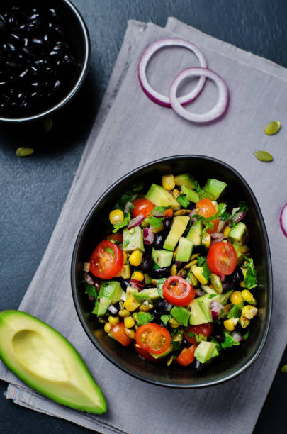 istock Black beans corn avocado red onion tomato salad with lime dressing 654062332