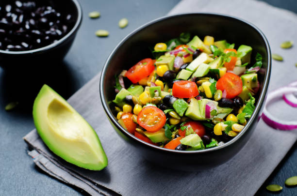 istock Black beans corn avocado red onion tomato salad with lime dressing 654062368