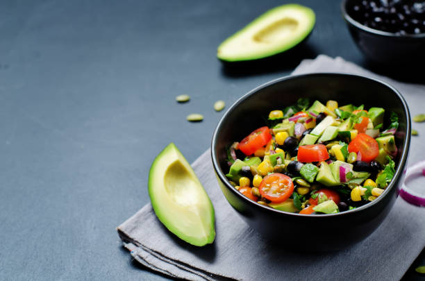 istock Black beans corn avocado red onion tomato salad with lime dressing 654062384