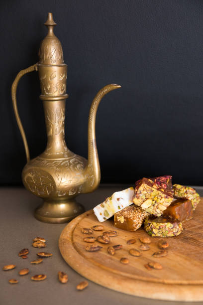 istock Turkish delight and jug on a grey background 654067668