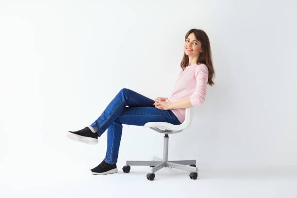 istock Happy woman sitting on chair on white background 654067920