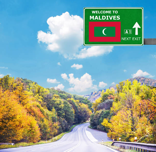Maldives road sign against clear blue sky Maldives road sign against clear blue sky visiting maldives stock pictures, royalty-free photos & images