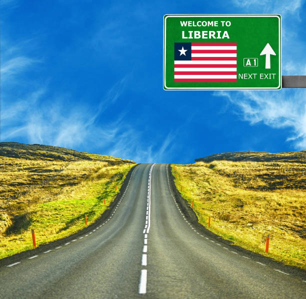 istock Liberia road sign against clear blue sky 654073060