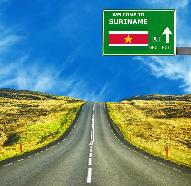 istock Suriname road sign against clear blue sky 654073296