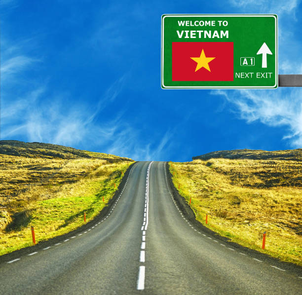 istock Vietnam road sign against clear blue sky 654073368