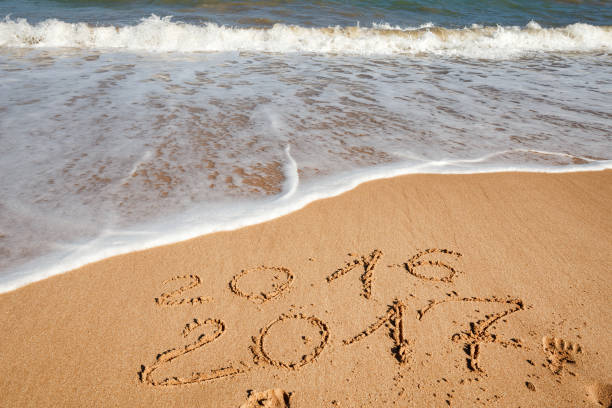 istock Happy New Year 2017 on the beach 654073492