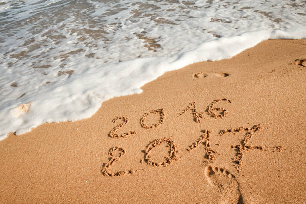 istock Happy New Year 2017 on the beach 654073496