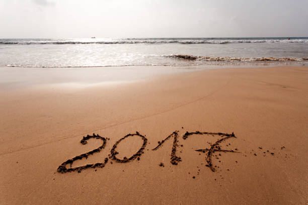 istock Happy New Year 2017 on the beach 654073540