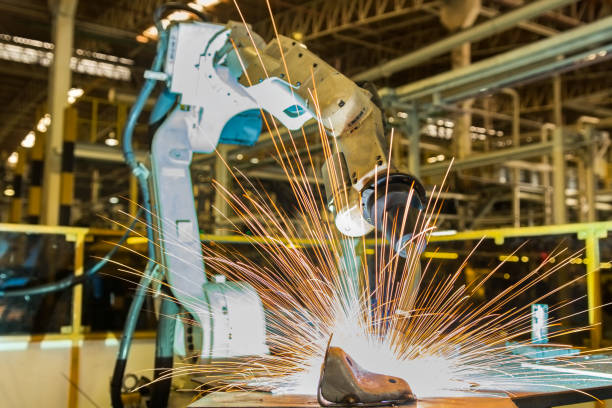 istock Robot is welding in car factory 654073544