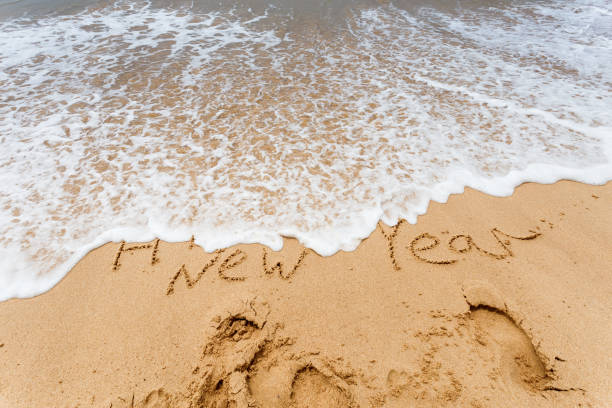 istock Happy New Year 2017 on the beach 654073550
