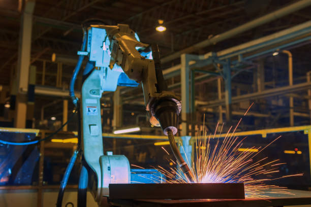 istock Robot welding in car factory 654073686