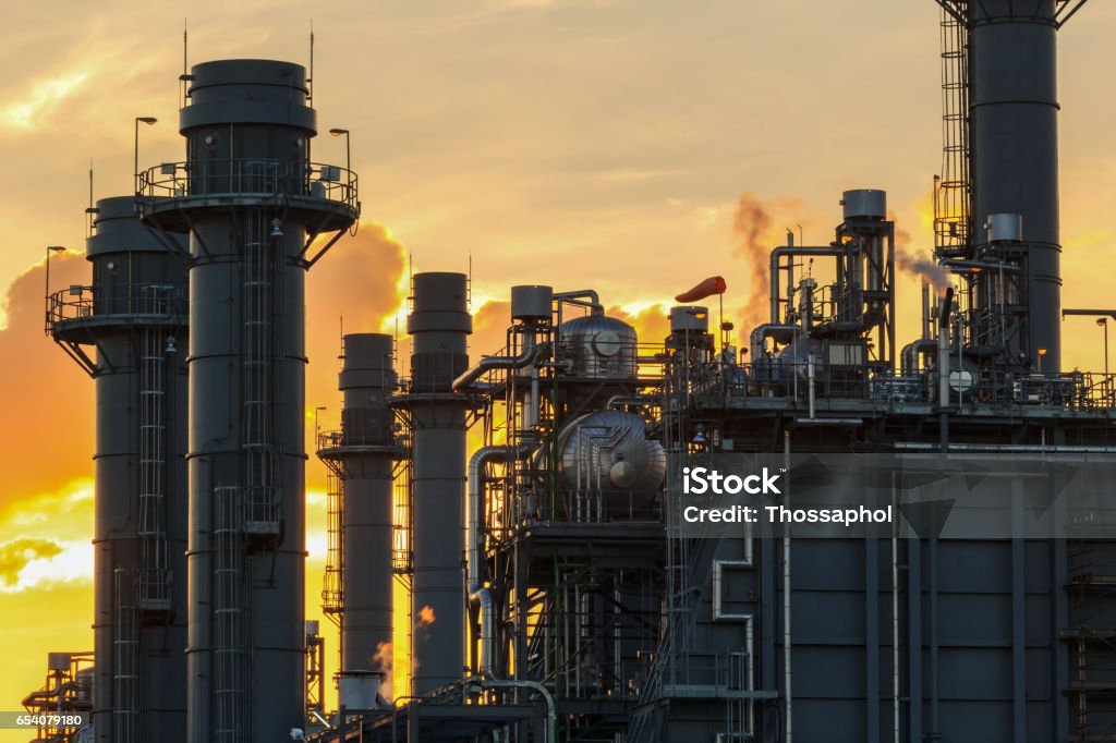 Natural Gas Combined Cycle Electrical Power Plant with golden hour Boiler Stock Photo