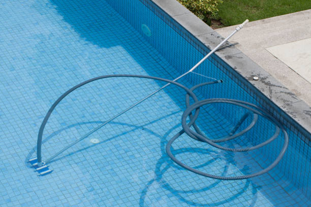 istock Pool with the underwater vacuum cleaner. 654084488