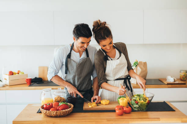 istock Young couple cooking in the kitchen 654084794
