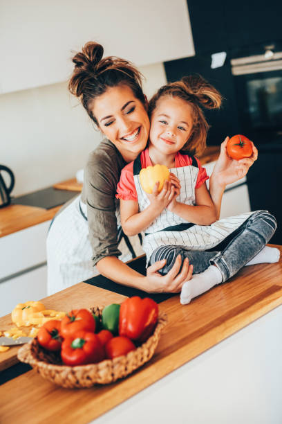 istock Mother and daughter cooking 654084818