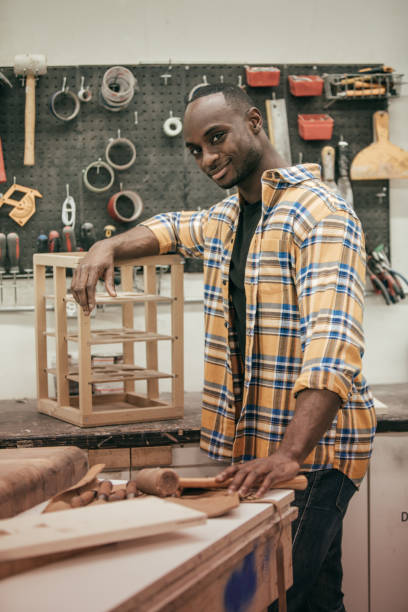 istock Male carpenter working with tools in his wood shop 654085244