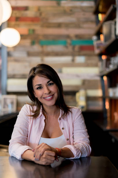 istock Happy business owner at a restaurant 654089662