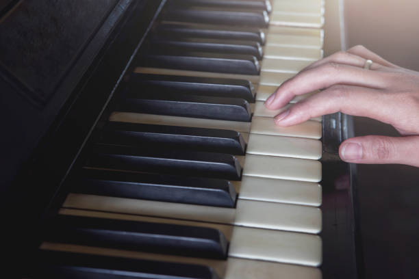 istock Pianist use hand to play piano 654100120
