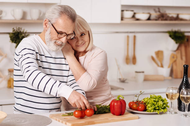 istock Cute elderly couple preparing family dinner in the kitchen 654102798