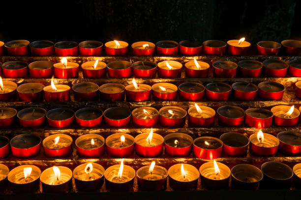 istock Glowing candles in the church 654104160