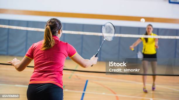 Woman Playing Badminton Stock Photo - Download Image Now - Badminton - Sport, Sport, 25-29 Years