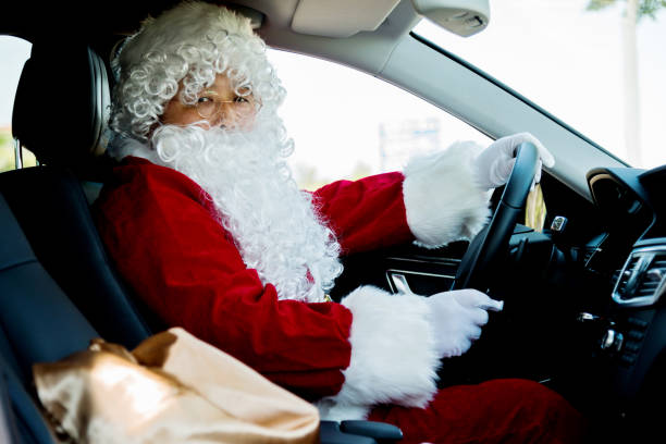 istock Santa claus driving a car 654111050