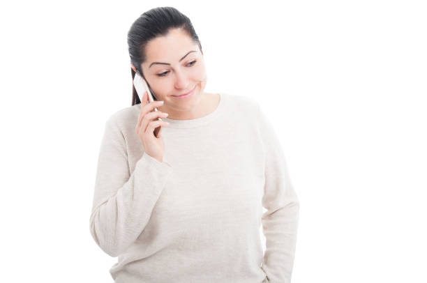 Happy female having a conversation on smartphone isolated on white background