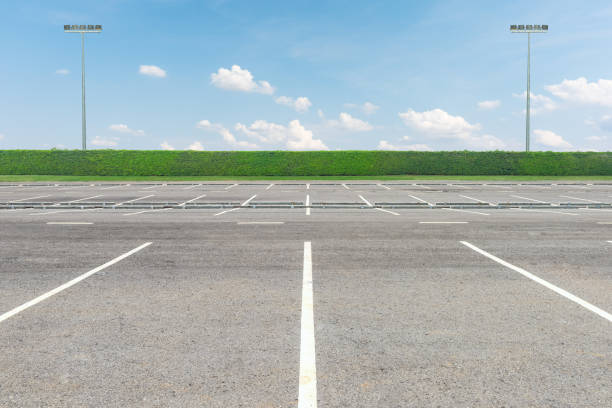 istock Empty parking lot against a beautiful blue sky 654117672