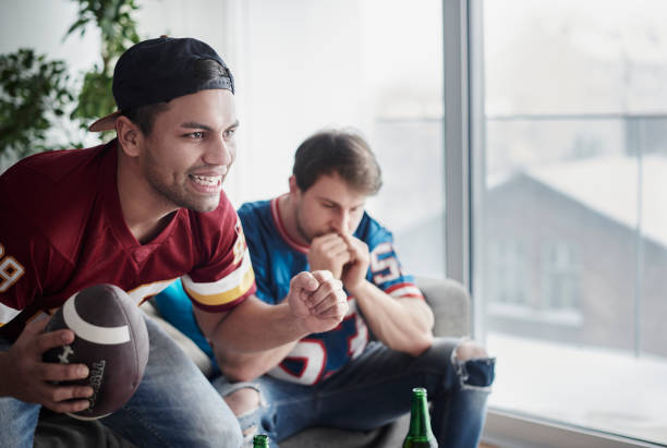istock Two young adults wishing another goal 654126314