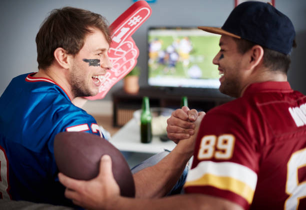 istock Best mates cherring after their team scores 654126522