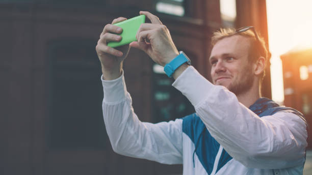 istock Man taking photo with his smartphone 654127560