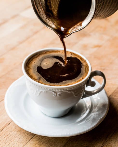 istock Pouring Turkish Coffee into the cup. 654128156