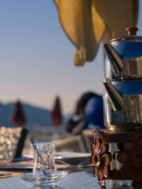 istock Turkish tea glass with tea pot 654131042