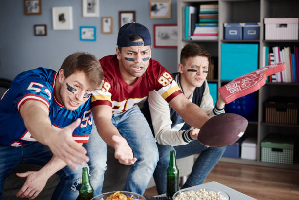 istock Unhappy men while watching American football 654133582