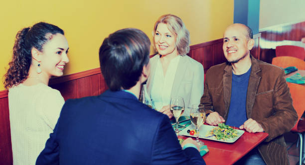 istock Positive middle class people enjoying food and wine 654134266