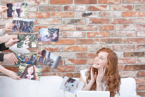 istock Happy woman watching her pictures 654134734