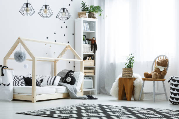 Bedroom with wood bed Child bedroom with white wall, wood bed, bookcase and chair door panel stock pictures, royalty-free photos & images