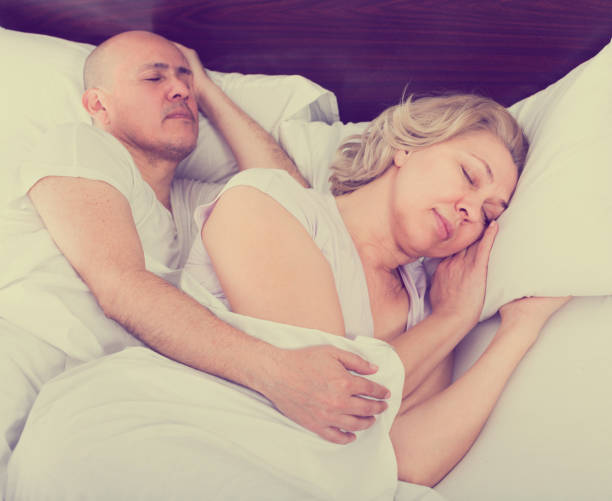istock Mature couple sleeping in bed 654140272