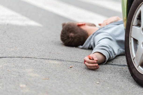 istock Traffic accident.Young man hit by a car 654142718