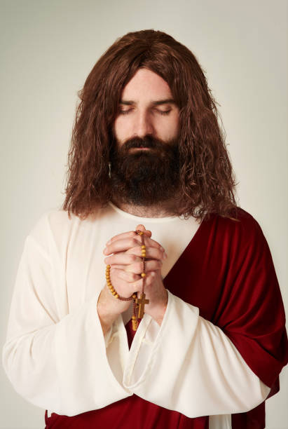 istock Studio shot of Jesus with rosary 654148114