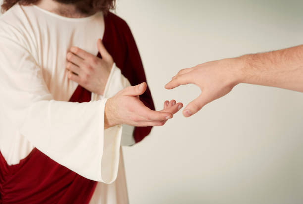 istock Jesus saving hand reaching for the faithful 654153050