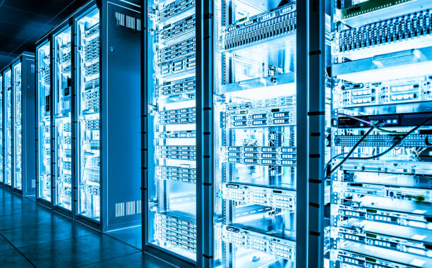 Big data dark server room with bright equipment stock photo