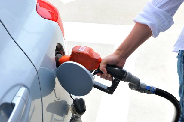 istock Humans put gasoline in the car 654157338