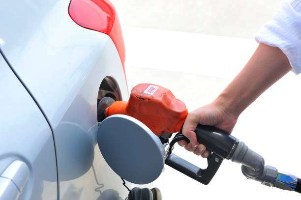 istock Humans put gasoline in the car 654157342