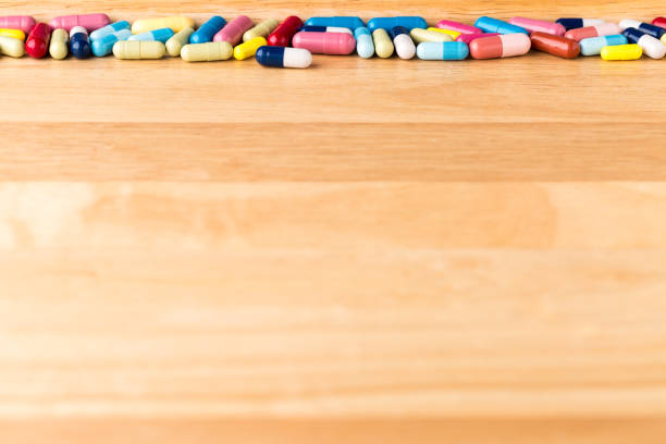 istock Top border from colorful medicine capsules 654158080