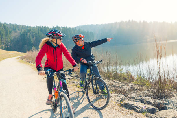 istock Couple Cycling Through Countryside Together 654160792