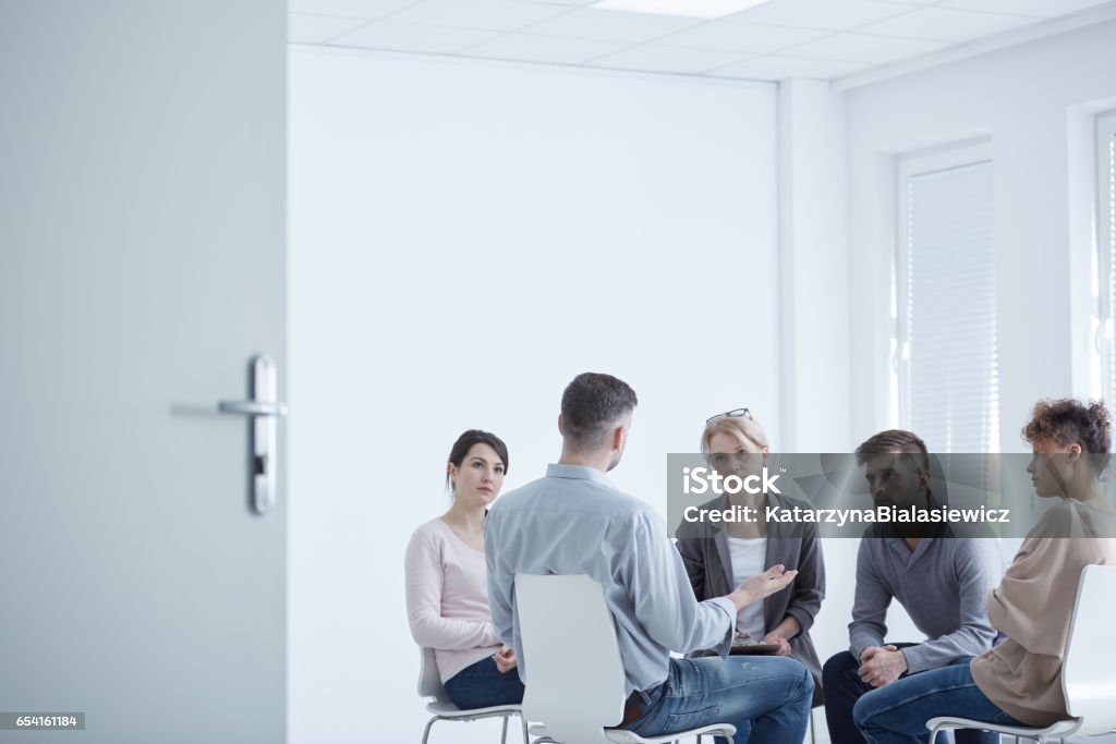 Group therapy for PTSD People participating in group therapy for PTSD Psychotherapy Stock Photo