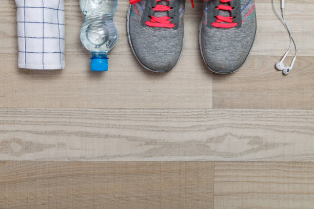 istock Fitness equipment. Sneakers, bottle with towel. 654163708